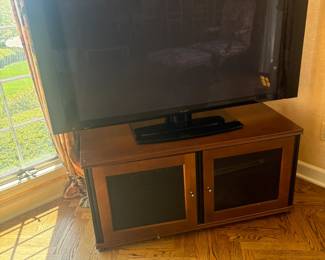 . . . TV stand and flat-screen TV
