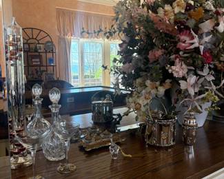 . . . crystal decanter and floral arrangement