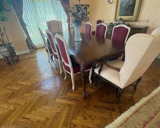 . . .  formal walnut dining table and chairs