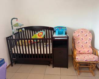 Baby crib w/ built in changing table, storage, trundle and adjustable mattress