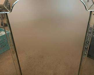 Etched glass mirror.