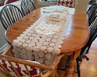 farmhouse style oak table with leaves, 4 Windsor style side chairs painted black, 2 Windsor style armchairs in oak