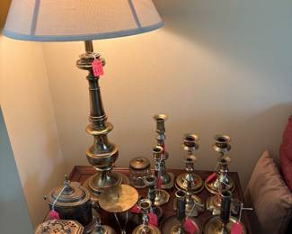lots of brass candlesticks plus a vintage brass lamp