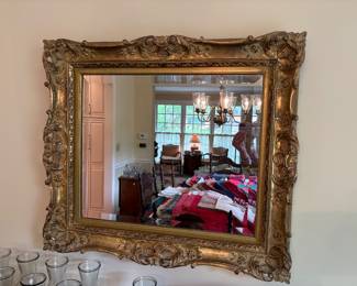 very pretty rectangular mirror with an ornate gold frame