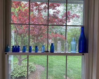 antique blue pharmacy and medicine bottles