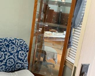 Curio cabinet with glass doors on sides, glass shelves