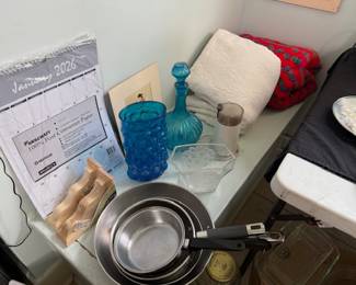 Pans, calendar, blue glass, throws