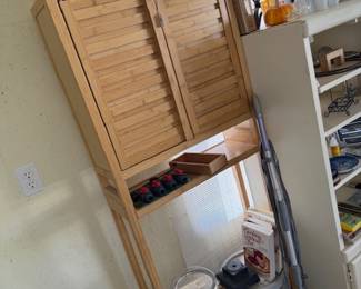 Wood over the toilet shelf