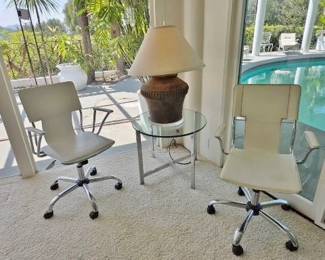 White Leather Desk Chairs; Milo Baughman-Style Glass Chrome Side Table; Large Clay Pot Lamp