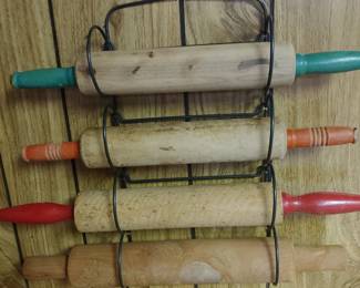 Vintage wood rolling pins in wire holder
