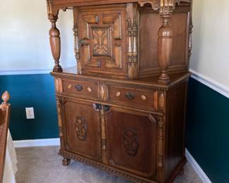 $1025 This beautifully cared for /40s Jacobean Revival Gothic Carved Romano Oak Court Cupboard/ Cabinet shows some Georgian influences. The piece has a planked top overhanging a frieze exquisitely adorned with detailed etching.