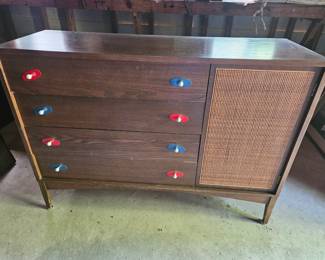 $125 Mid-Century Modern credenza featuring a dark walnut finish, a cabinet with woven cane paneling, and unique red and blue hardware.
