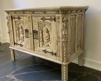 $1200 Gorgeous Gothic Revival style carved oak sideboard featuring two doors with intricate carvings and hand-forged iron hardware.  
