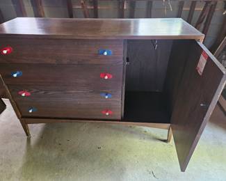 $125 Mid-Century Modern credenza featuring a dark walnut finish, a cabinet with woven cane paneling, and unique red and blue hardware.