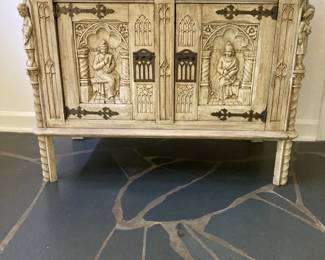 $1200 Gorgeous Gothic Revival style carved oak sideboard featuring two doors with intricate carvings and hand-forged iron hardware.  