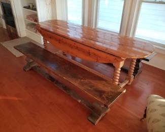 Rustic drop leaf table is 90" long. Benches are for sale but do not match table