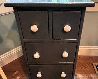 Four drawer cabinet. 15" W x 11 1/2" D x 25" H.