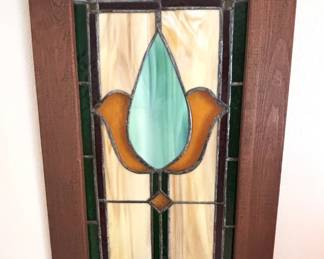 Framed stain glass window.