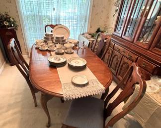 BUY IT NOW! $250.00.Table w/six Chairs( two arm chairs), w/2 15" leaves and custom table pads. 42" W x 66" L (96" L w/both leaves ). Call Jan at 314 960-5700.