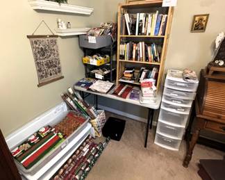 Lots of wrapping paper, ribbon, books and gift bags.