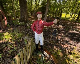 Base of the lawn jockey is crumbling.