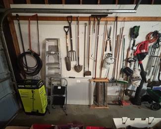 Shovels, rakes, garden tools.