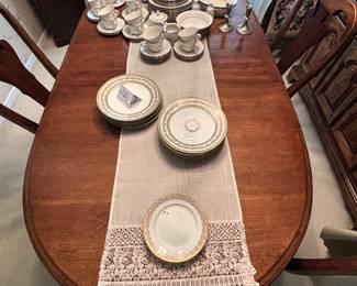 BUY IT NOW! $250.00.Table w/six Chairs( two arm chairs), w/2 15" leaves and custom table pads. 42" W x 66" L (96" L w/both leaves ). Call Jan at 314 960-5700.