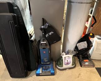 Foam padded hard shell gun cases, vacuums, floor cleaners, 45 qt dehumidifier.