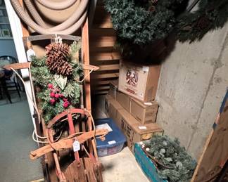 Vintage wooden sleds, Christmas trees and garland.