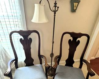 Two captains' chairs to be sold with dining room table.