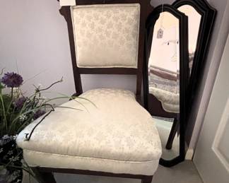 Antique upholstered chair.