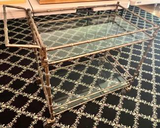 72. Stark Black Area Rug w/ Floral Crisscross Pattern      70. Antique Gold Bamboo & Glass Bar Cart