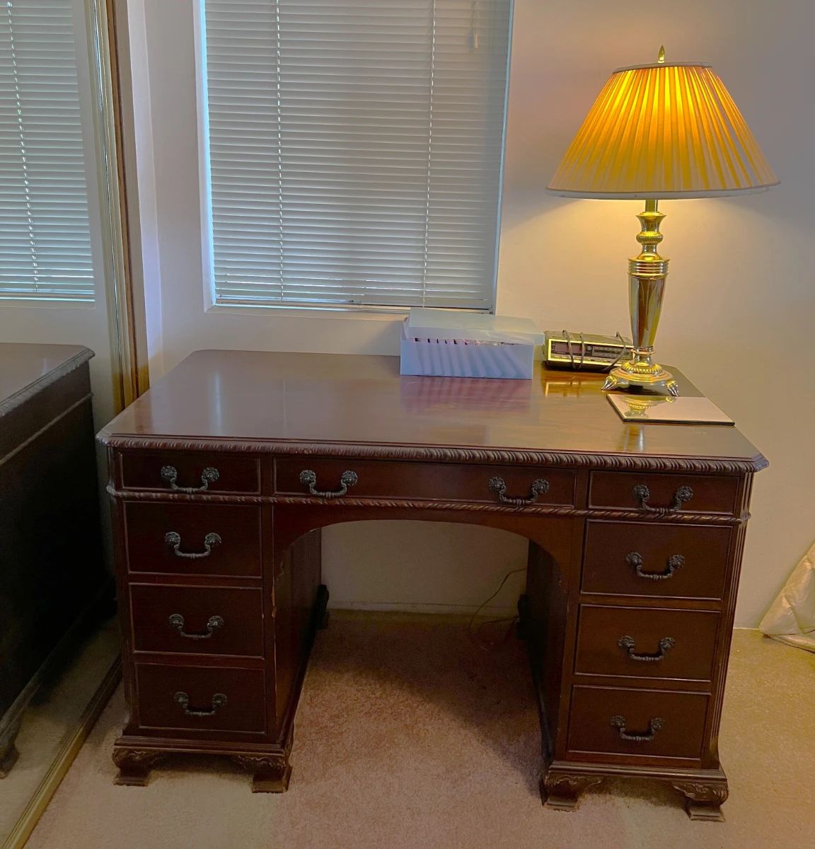 Here is a desk you could use that exudes style.  Don't forget the lamp.