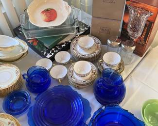 This picture shows a few different dishes and sets: more Noritake, the blue glass (cobalt glass, if you prefer), a couple of Mikasa crystal pieces, and more.