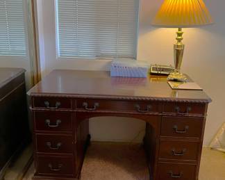 Here is a desk you could use that exudes style.  Don't forget the lamp.