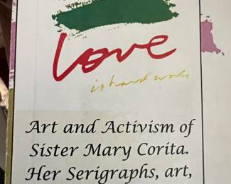 This photo shows "Love is hard work" by Sister Mary Corita.
