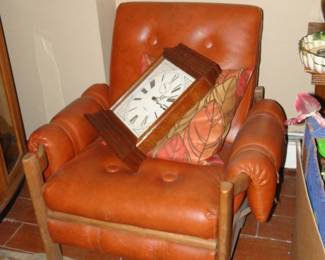 Vintage leather chair has matching ottoman