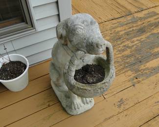 Concrete dog with basket