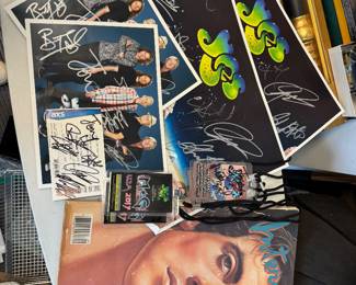 Autographs from the band YES, and yes signed in front of me