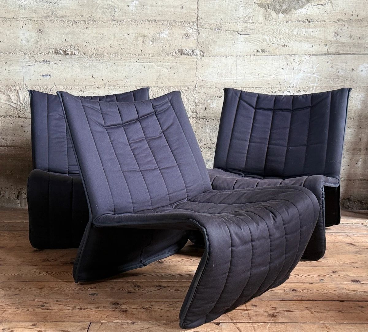 This lot features three (3) Kebe Ribbon Chairs designed by Niels Bendtsen in 1975, featuring a black tubular steel frame and quilted fabric. Each chair measures, 28” H x 25” W x 29” D.