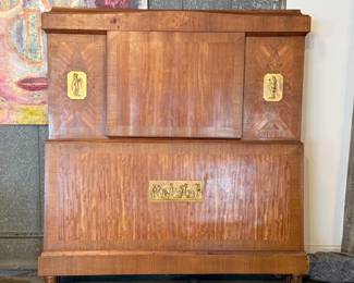 This lot features what is believed to be a 19th century French bed frame with thick veneered burl wood and large brass plaques inlaid throughout the headboard and footboard. Comes complete with rails and measures, 58” H x 53” W – believed to fit a modern full sized mattress.