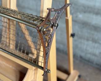 This lot features an antique brass train car luggage rack in very good condition that measures, 29.5” W x 12.5” D.