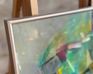 This lot features a vibrant abstract mixed-media painting by an unknown artist. Comes professionally framed and measures in frame, 22” H x 27” W.