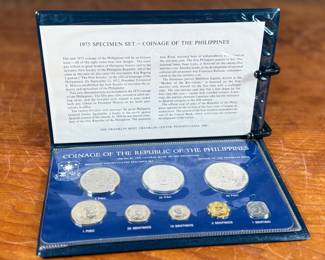 This lot features a 1975 Republic of the Philippines 8-coin specimen set produced by the Franklin Mint. This proof set was issued by the Central Bank of the Philippines and includes denominations from the 1 Sentimo up to the 50 Piso. The set features 1.2166 troy ounces of silver in the higher denomination coins. It includes a square-shaped 1 Sentimo coin and commemorates the “New Society” movement.