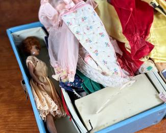 This lot features a vintage 1961 Mattel Barbie Ponytail carrying case full of barbies and accessories.