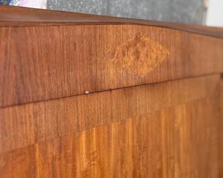 This lot features what is believed to be a 19th century French bed frame with thick veneered burl wood and large brass plaques inlaid throughout the headboard and footboard. Comes complete with rails and measures, 58” H x 53” W – believed to fit a modern full sized mattress.