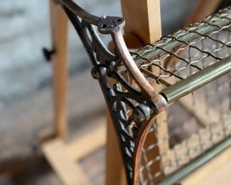 This lot features an antique brass train car luggage rack in very good condition that measures, 29.5” W x 12.5” D.