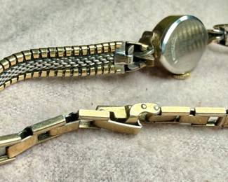 This lot features a 10k gold-filled mechanical watch by Zodiac. Winds and runs.