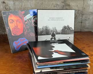 This lot features a large collection of twenty-six (26) vinyl records including artists Barbara Streisand, Aretha Franklin, Ray Charles, George Harrison, and many others.