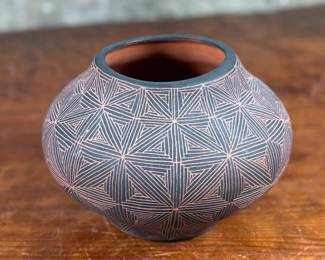 This lot features a stunning pottery vessel by listed artist, Debra Waconda. Signed underneath as shown in photos and measures, 5” H. Debra Waconda is a renowned Acoma Pueblo artist known for hand-coiling, painting, and signing fine-line black-on-white pottery, frequently featuring geometric patterns and intricate designs, with active pieces dating from the 1990s and 2000s. Her work, along with other Acoma potters such as Elizabeth Waconda, is considered authentic Native American Pueblo art.